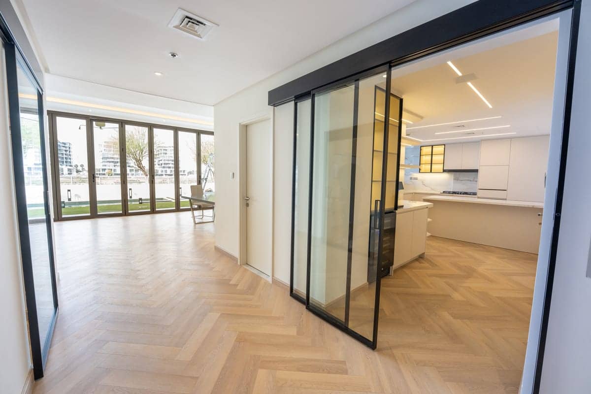 Open plan glass partition herringbone — renovation in Dubai by Turnkey Renovations